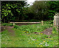 Wooden barrier across a track into Millrough Wood, Lydney