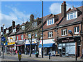 Businesses and flats in Bowes Road (A1110) west of Arnos Grove tube station