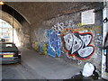 TQ3483 : View of street art under the railway bridge on West Street by Robert Lamb
