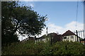 View of houses on Ongar High Street from the path above the buffer stops at Ongar station