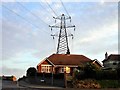 House under electricity transmission wires