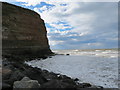 NZ7819 : The  bulk  of  Cowbar  Nab  from  Staithes  harbour  breakwater by Martin Dawes