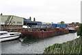 Rusty barge on River Hull by Grovehill Bridge