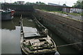 View of a derelict boat in the Roding at Town Quay