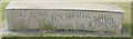 View of a carved concrete block on the small green next to Town Quay #3