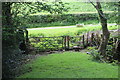 Gate and stile near private road