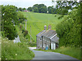 Steeply downhill past Bradford Peverell Farm