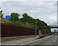 TQ0698 : Emergency vehicles lane under Chandler's Lane bridge over M25 by David Smith