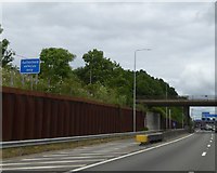 TQ0698 : Emergency vehicles lane under Chandler's Lane bridge over M25 by David Smith