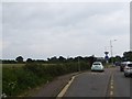 Bus stop and pull-off on B1027 at junction with Jaywick Lane