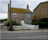 SY4690 : Semi-detached cottages and a white picket fence, West Bay by Jaggery