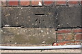 Benchmark on railway bridge on Danby Lane