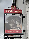 TL5562 : The sign of The Black Horse Inn at Swaffham Bulbeck by Adrian S Pye