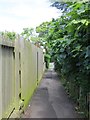 Enclosed pathway between housing to A65 in Ben Rhydding