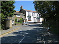 Station Road at its junction with Haworth Road (B6144) at Harecroft