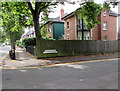 Wooden fence and metal railings on a Cheltenham corner