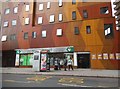 Brown and yellow block on New Kent Road