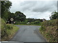 Junction of a minor road with the B3266 near Tinten Manor