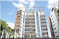 View of the rear of apartments in Hutchings Wharf from the Thames Path