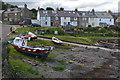 NU2519 : Boats and houses, Craster Harbour by David Martin