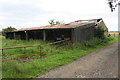 Old barns beside track to Firtree Farm