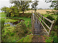NH5558 : Footbridge on the coastal path beside the upper reaches of the Cromarty Firth by valenta