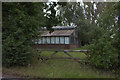 Derelict looking glasshouse near Elmshaw