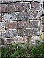 SJ4803 : OS benchmark - Great Ryton, wall north of road junction by Richard Law