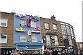 View of the shop fronts of Brandshop and Skins from Camden High Street