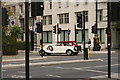 View of a vintage car turning into Savoy Street from the Victoria Embankment