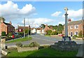SK8381 : Marton, High Street and the medieval cross war memorial by Alan Murray-Rust