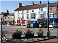 Shops beyond flower tubs in Northallerton