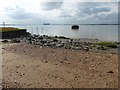 TQ6975 : Mud and shingle in a  bay next to Higham Saltings by Marathon
