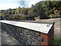 Memorial wall in the Welsh National and Universal Mining Memorial Garden, with names of victims of the 1913 Universal Colliery d