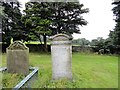 NZ0449 : Gravestones in Muggleswick churchyard. by Robert Graham