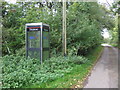 Overgrown telephone box on Quee Lane, Scounslow Green