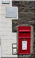 Queen Elizabeth II postbox in the wall of 229  Brithweunydd Road, Trealaw