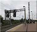 SJ6087 : Signal gantry at the southern end of Warrington Bank Quay railway station by Jaggery