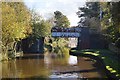 Rusty railway bridge over the Trent & Mersey Canal