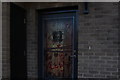 View of a front door decorated for Halloween on South Access Road