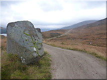 NN3766 : Roadside boulder by Richard Law