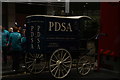 TQ3281 : View of a PDSA carriage assembled for the Lord Mayor's Parade on Noble Street by Robert Lamb