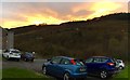 Cars parked off street in the setting sun