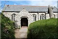 SW6620 : South doorway and porch, St Winwaloe's church, Gunwalloe by Derek Voller