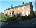 Terraced cottages at the corner of Woolhope Road