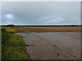 Concrete pad in corner of a field