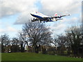 A plane landing over Myrtle Avenue