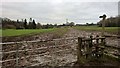 Stile to a muddy field