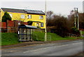 SS9084 : Yellow houses behind a Bryn Road bus stop and shelter, Brynmenyn by Jaggery