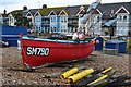 Red boat on beach at East Worthing